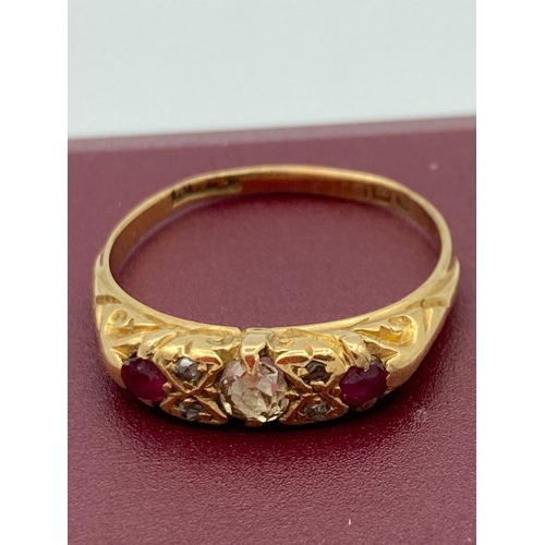 27 - Antique 18 carat GOLD, DIAMOND and RUBY RING. Shank slightly out of shape. 2.9 grams. Size N.