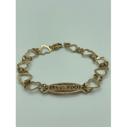 41 - 9 carat GOLD ‘I LOVE YOU’ BRACELET with heart shaped links. Full UK hallmark. 3.57 grams. 17 cm.