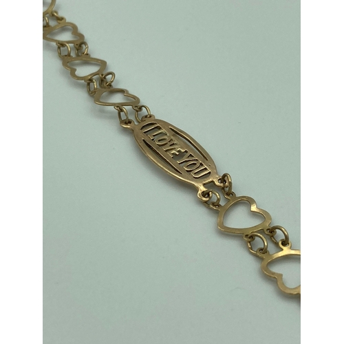 41 - 9 carat GOLD ‘I LOVE YOU’ BRACELET with heart shaped links. Full UK hallmark. 3.57 grams. 17 cm.