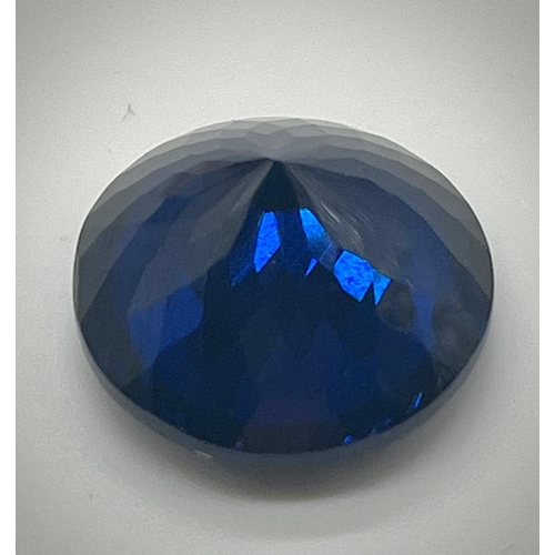 529 - A 36ct Round Cut Dark Blue Gemstone. Well-faceted. 20mm upper diameter. No certificate so a/f.