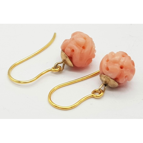 688 - A Pair of 9K Gold and Pink Coral Earrings. 1.95g total weight.