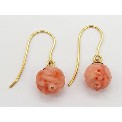 688 - A Pair of 9K Gold and Pink Coral Earrings. 1.95g total weight.