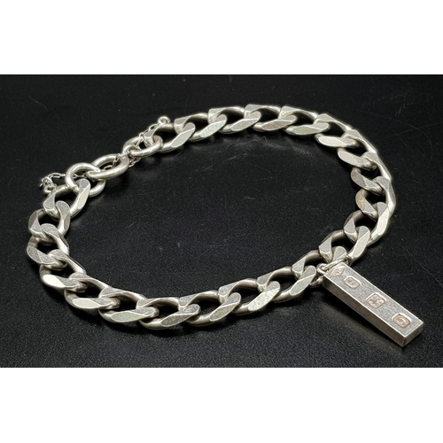 1113 - A 925 Silver Flat Curb Link Bracelet with Hanging 925 Silver Ingot. 25mm and 20cm. 26.12g