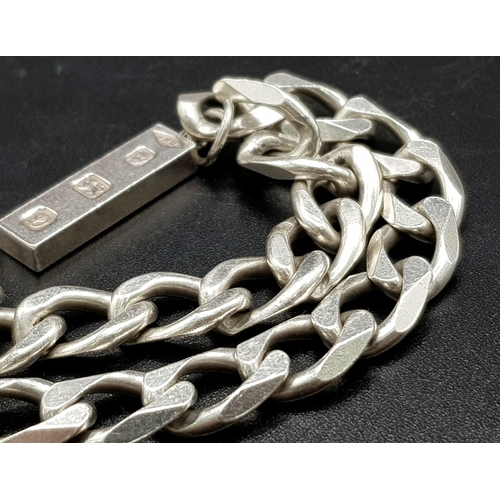 1113 - A 925 Silver Flat Curb Link Bracelet with Hanging 925 Silver Ingot. 25mm and 20cm. 26.12g