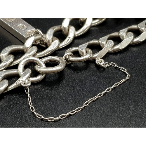 1113 - A 925 Silver Flat Curb Link Bracelet with Hanging 925 Silver Ingot. 25mm and 20cm. 26.12g