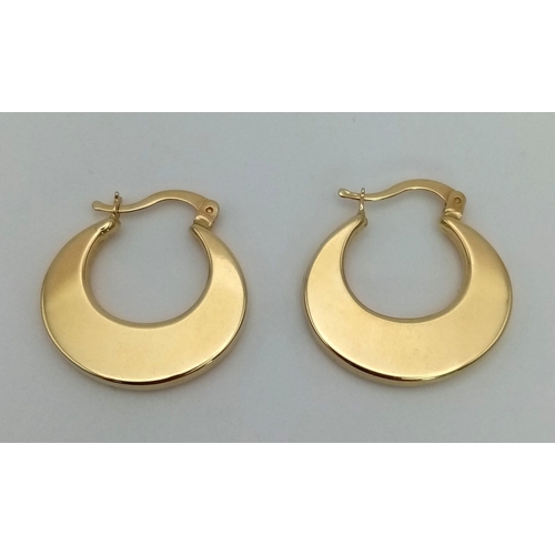 183 - A Pair of 18K Yellow Gold Crescent Hoop Earrings. 3.56g total weight.