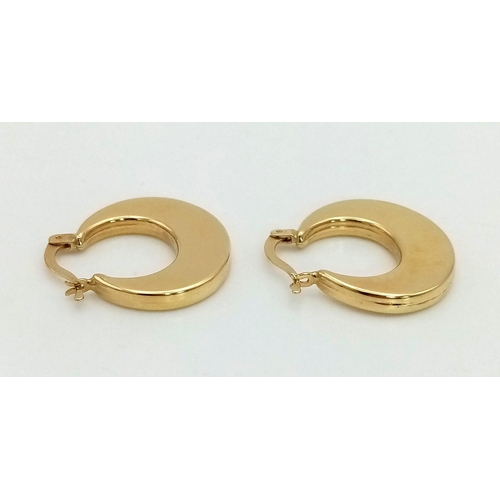 183 - A Pair of 18K Yellow Gold Crescent Hoop Earrings. 3.56g total weight.