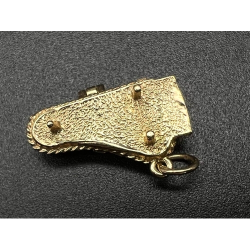 289 - 9K YELLOW GOLD PIANO CHARM WHICH OPENS 4G