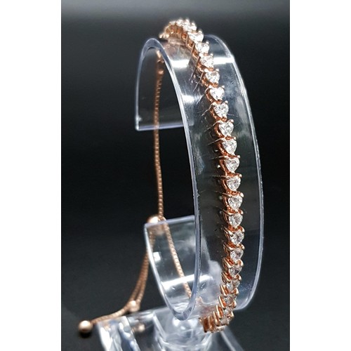 677 - A Sterling Silver Rose Gold Plated Bracelet with White Stone Decoration. 18cm. Comes with a presenta... 