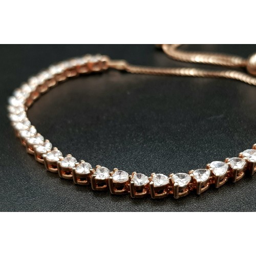 677 - A Sterling Silver Rose Gold Plated Bracelet with White Stone Decoration. 18cm. Comes with a presenta... 