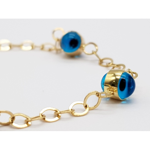 823 - 14K YELLOW GOLD EVIL EYE BRACELET 2.6G