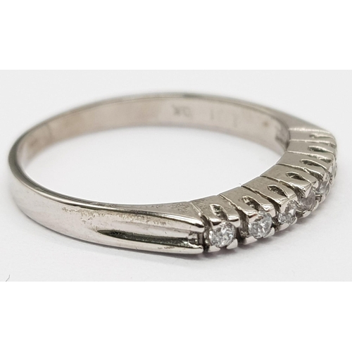 506 - 14K WHITE GOLD DIAMOND SET HALF ETERNITY BAND RING 0.14CT 1.7G SIZE K