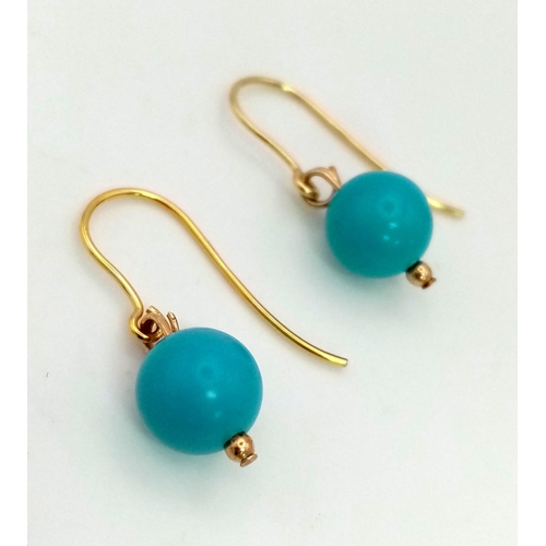 830 - A Pair of 9K Gold and Turquoise Ball Earrings. 1.46g total weight.