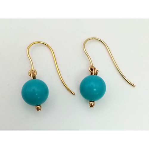 830 - A Pair of 9K Gold and Turquoise Ball Earrings. 1.46g total weight.