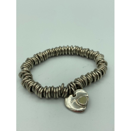 1110 - SILVER BRACELET with marking for links of London and having 925 SILVER HEART CHARM.