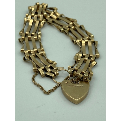 644 - Vintage 9 carat GOLD GATE BRACELET With heart padlock fastening and gold safety chain. 9.2 grams.