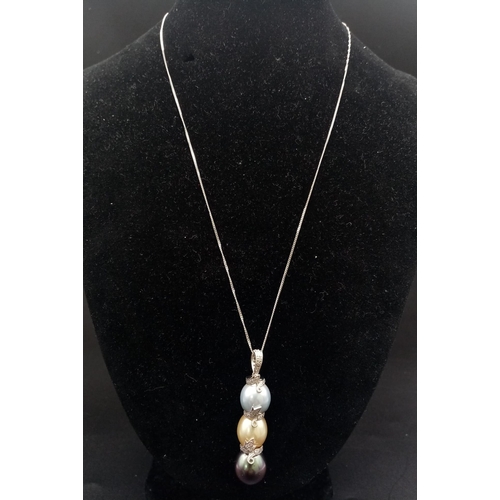 313 - A Beautiful Three-Colour South Sea Pearl and Diamond Pendant on an 18K White Gold Disappearing Neckl... 