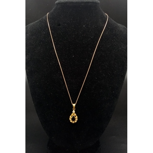 816 - An 18K Gold Sapphire and Diamond Pendant on an 18K Gold Necklace. 25mm and 42cm. 4.09g total weight