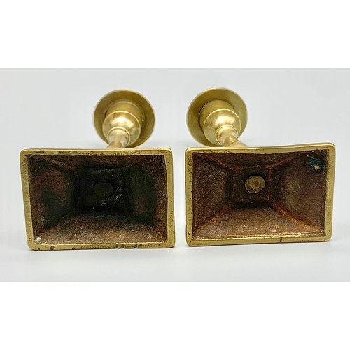 1217 - A PAIR OF SMALL BRASS CANDLESTICKS .303.4gms  12cms