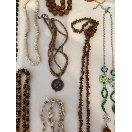 484 - Collection of jewellery in natural materials,to include wood, tapestry,faux shell, wood effect,etc. ... 