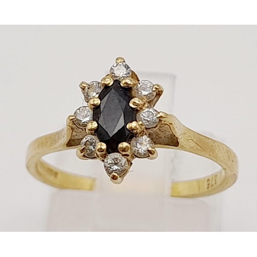 624 - A 9K Yellow Gold Sapphire and White Stone Ring. Size K. 1.62g total weight.