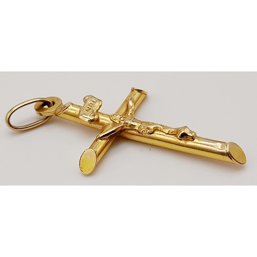 646 - A 9K Yellow Gold Crucifix Pendant. 3.5cm. 0.9g