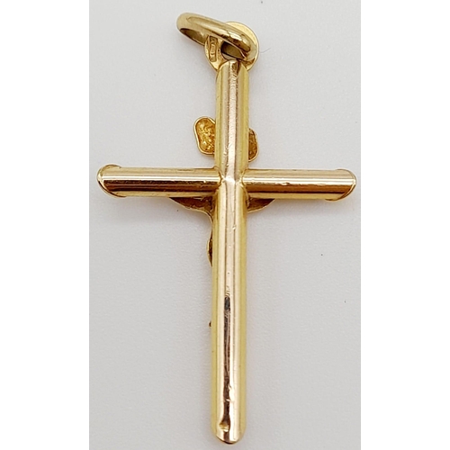 646 - A 9K Yellow Gold Crucifix Pendant. 3.5cm. 0.9g