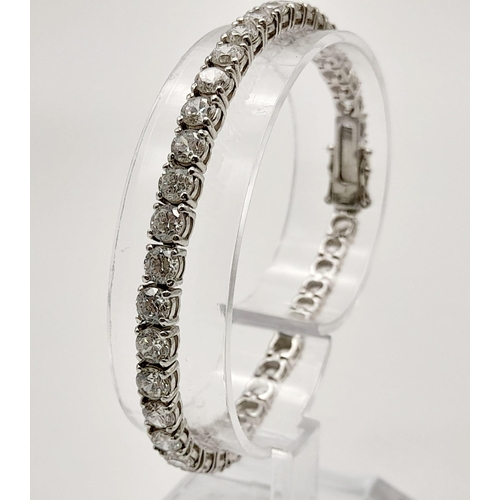 653 - A 925 Silver Tennis White Stone Bracelet. 19cm. Good quality round cut CZ stones. 13.31g total weigh... 