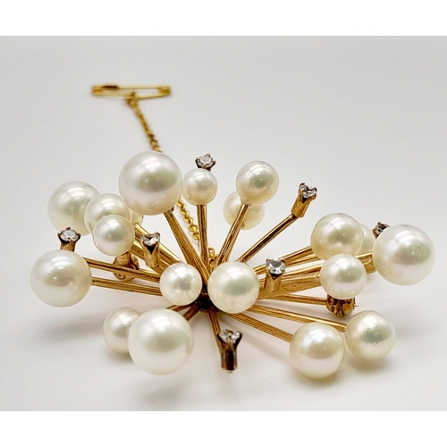 655 - A 14K Yellow Gold and Pearl Floral Burst Brooch. White stone decoration. 11.44g total weight.