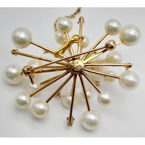 655 - A 14K Yellow Gold and Pearl Floral Burst Brooch. White stone decoration. 11.44g total weight.