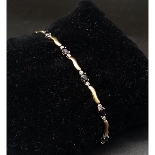 255 - 9k yellow gold diamond and sapphire bracelet, 19cm length, (dia:0.01ct sapphire: 0.30ct) 4.5g