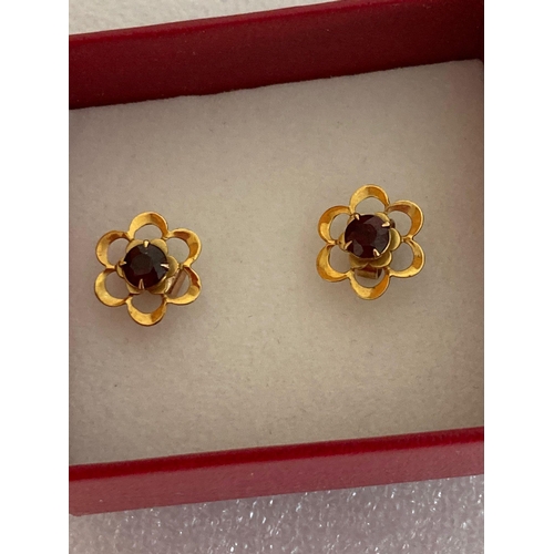 48 - Pair of hallmarked 9 carat GOLD EARRINGS set with Garnet. Complete with 9 carat gold butterfly backs... 