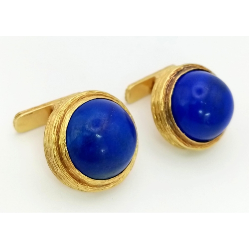 614 - A Pair of Pablo 18K Gold and Lapis Lazuli Cufflinks. Two large Afghanistan lapis cabochons set in ri... 