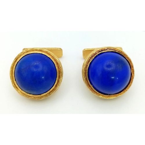 614 - A Pair of Pablo 18K Gold and Lapis Lazuli Cufflinks. Two large Afghanistan lapis cabochons set in ri... 