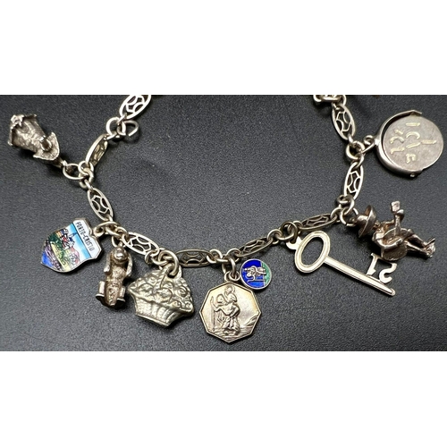 648 - A Vintage 925 Silver Charm Bracelet. 18cm. 21.5g total weight.