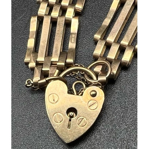 458 - A Vintage 9K Yellow Gold Gate Link Bracelet with Heart Clasp. Full UK hallmarks. 16cm. 9.21g