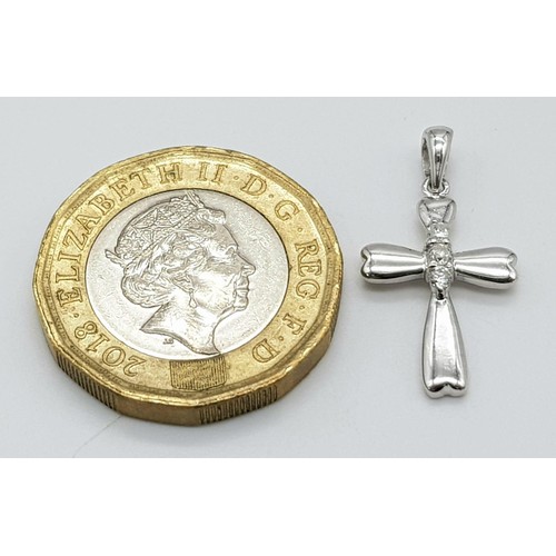 423 - 9K WHITE GOLD DIAMOND SET CROSS 0.9G