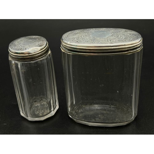 668 - Two Victorian Glass and 925 Silver Lidded Containers. Circular and oval. Hallmarks for London 1876. ... 