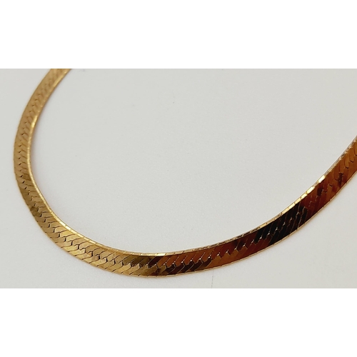 647 - A 9K Yellow Gold Herringbone Bracelet. 18cm. 1.73g