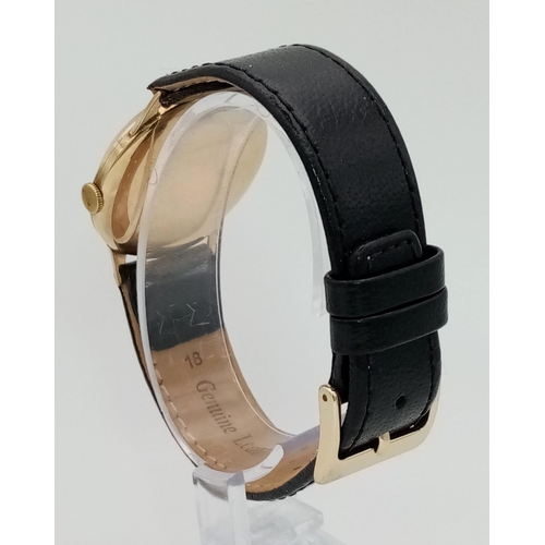 683 - A Vintage Accurist 9K Gents Gold Watch. Black leather strap. 9K gold case - 32mm. Mechanical movemen... 