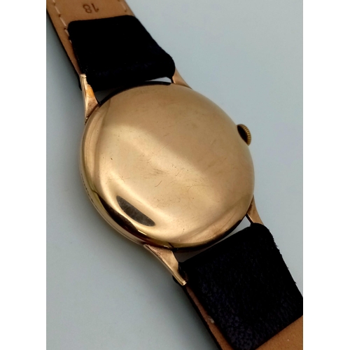 683 - A Vintage Accurist 9K Gents Gold Watch. Black leather strap. 9K gold case - 32mm. Mechanical movemen... 