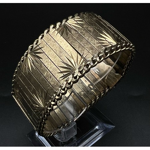 2 - An Asian Inspired 9k Yellow Gold Bar-Link Statement Bracelet. 50.58g  19cm. 3cm width.