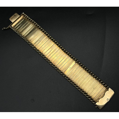 2 - An Asian Inspired 9k Yellow Gold Bar-Link Statement Bracelet. 50.58g  19cm. 3cm width.