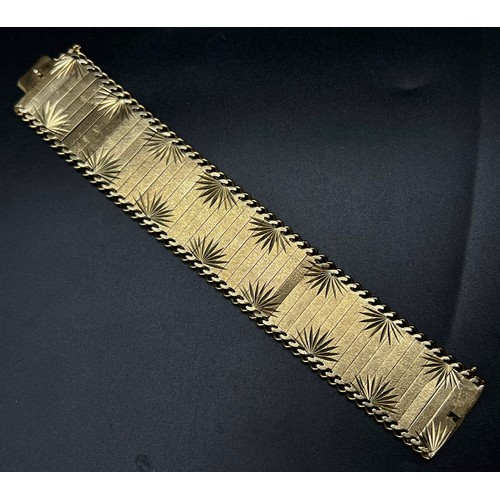 2 - An Asian Inspired 9k Yellow Gold Bar-Link Statement Bracelet. 50.58g  19cm. 3cm width.