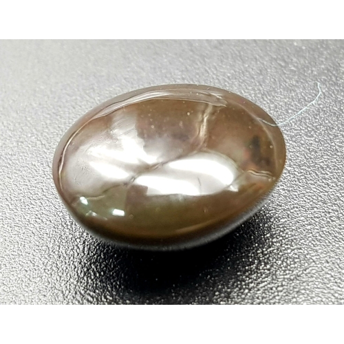 1254 - An Ethiopian 4.95ct Natural Black Opal. Oval Cabochon. Comes with GLI Certificate.