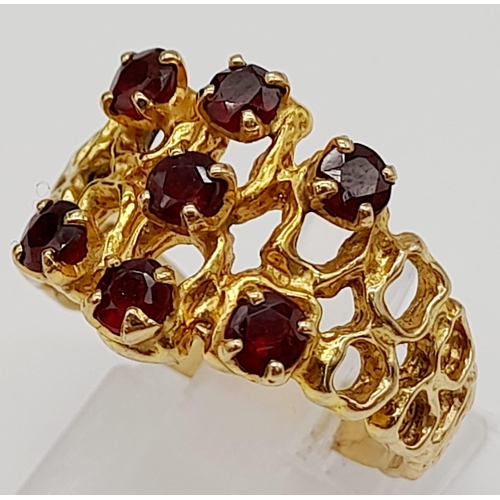 224 - A vintage, 9 K yellow gold ring with seven, excellent quality, round cut garnets. Ring size: Q, weig... 