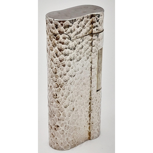 547 - A Vintage Dunhill Silver-Plated Lighter. Bark-effect decoration. In good condition but needs some ga... 