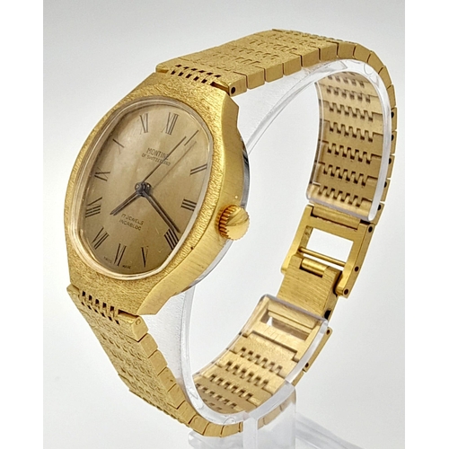 700 - A Vintage Montine of Switzerland Gold Plated Gents Watch. Case - 33cm. Gold tone dial. Automatic mov... 