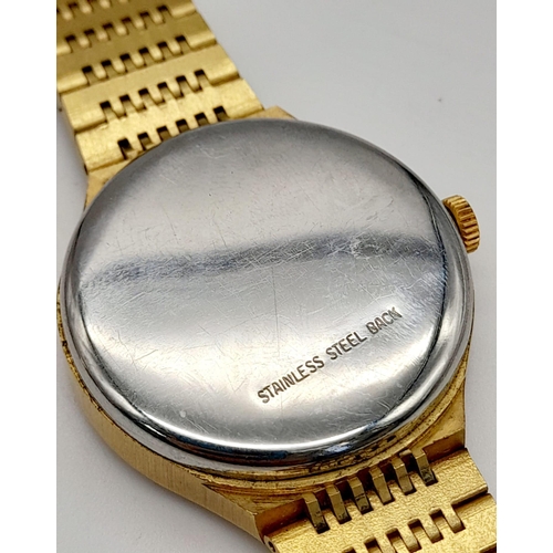 700 - A Vintage Montine of Switzerland Gold Plated Gents Watch. Case - 33cm. Gold tone dial. Automatic mov... 