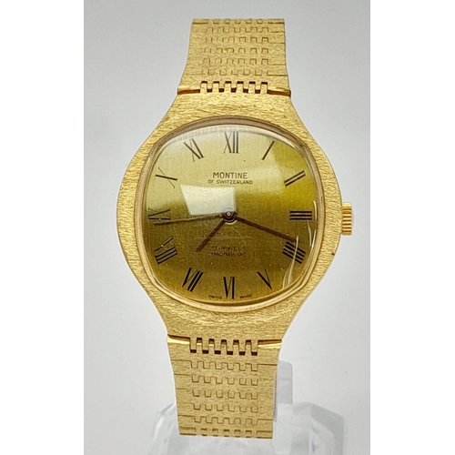 700 - A Vintage Montine of Switzerland Gold Plated Gents Watch. Case - 33cm. Gold tone dial. Automatic mov... 